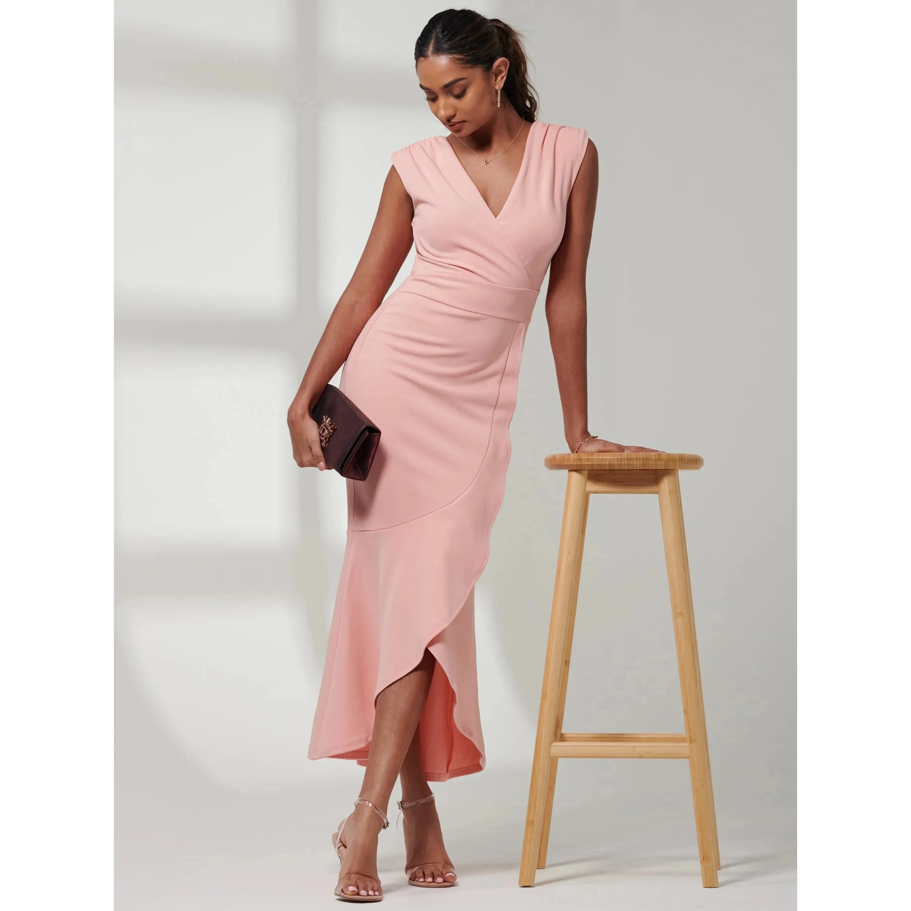 Jolie Moi Elegant Coral Pink Sleeveless Dress with V-Neck Wrap Top & Asymmetrical Frill Hemline