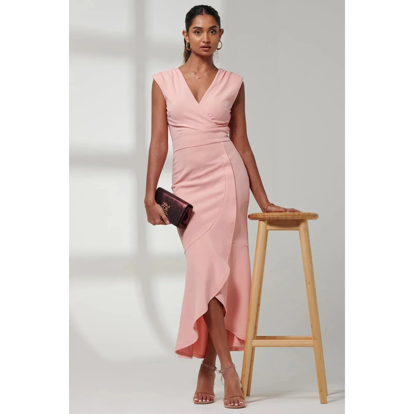 Jolie Moi Elegant Coral Pink Sleeveless Dress with V-Neck Wrap Top & Asymmetrical Frill Hemline